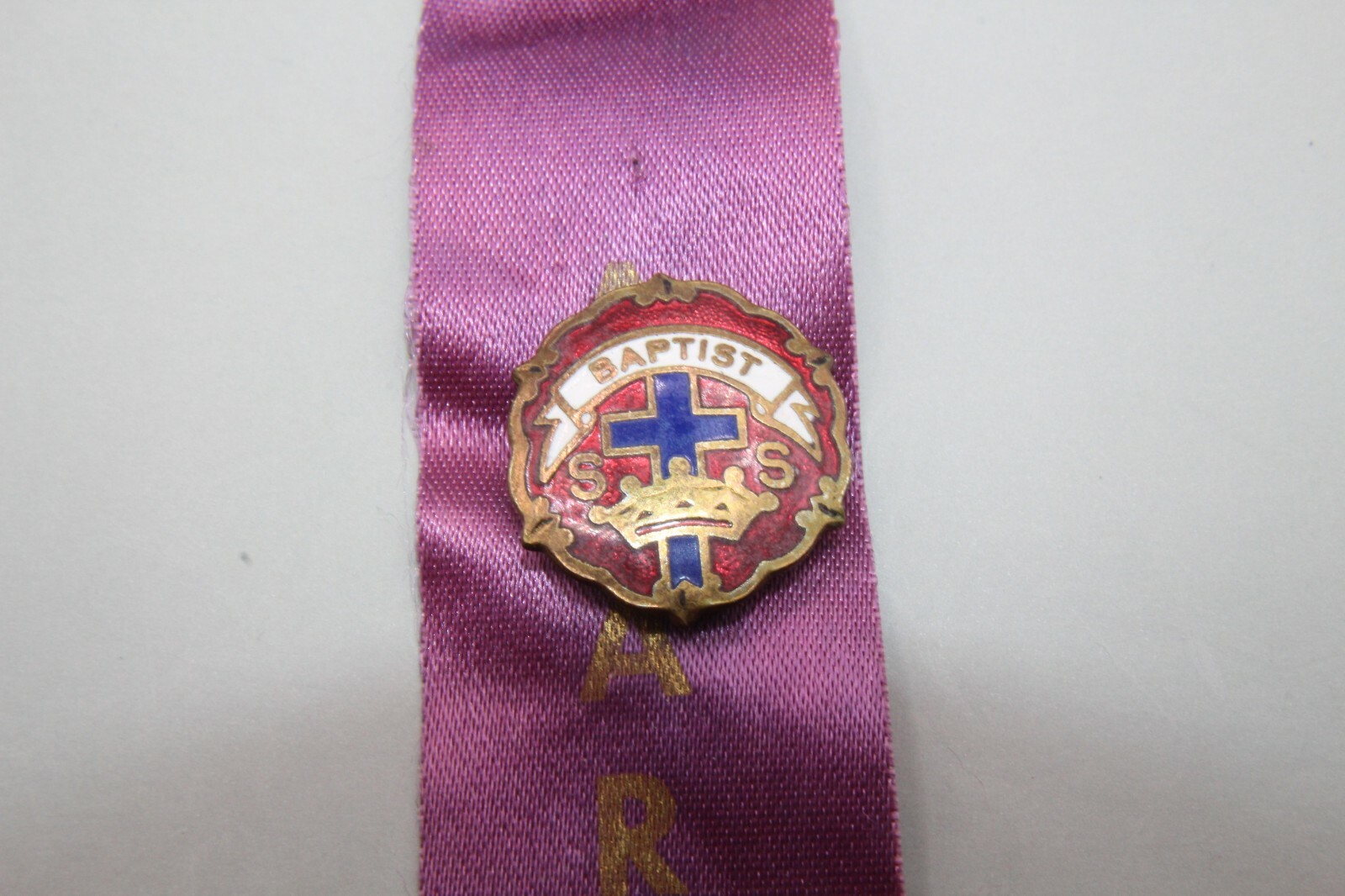 Award Ribbon with an Attached Multi-Colored Enameled Babtist Church Pin